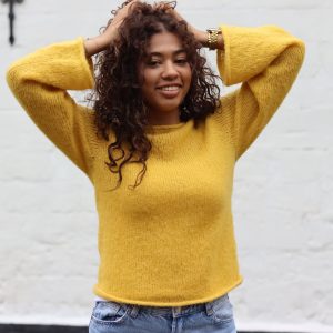 Handmade alpaca sweater in yellow, showcasing the luxurious texture and craftsmanship of alpaca wool & silk