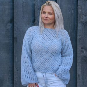 Model wearing a handmade alpaca sweater, offering a cozy and stylish look perfect for chilly weather